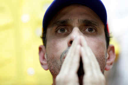 Venezuela's opposition leader Henrique Capriles gestures during a news conference in Caracas