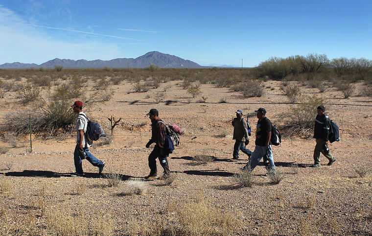 Undocumented Immigrants Cross Into The United States From Mexico