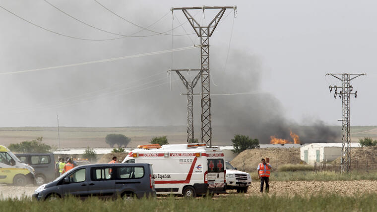 Fire and smoke are seen at the scene of an explosion at a fireworks factory on the outskirts of Zaragoza
