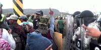 Migrantes se abren paso ante piquete de la Guardia Nacional