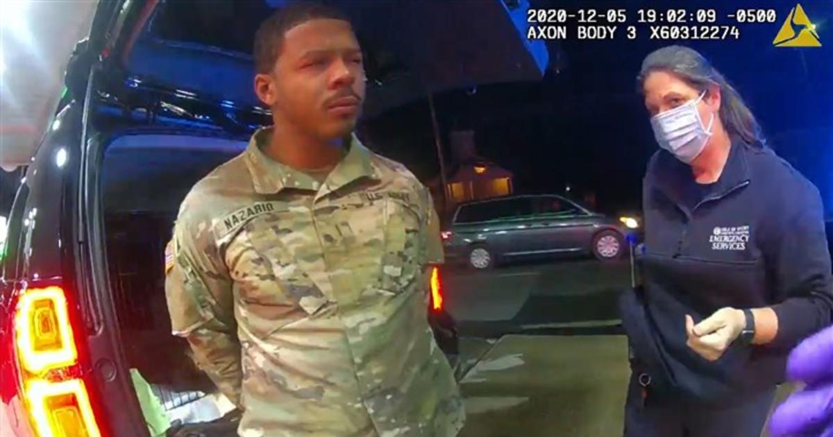 An African police officer asks Virginia police officers about the gun and intimidate them into their car