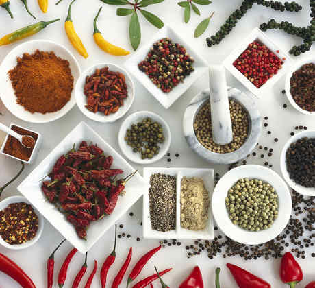 Spices on white background, elevated view